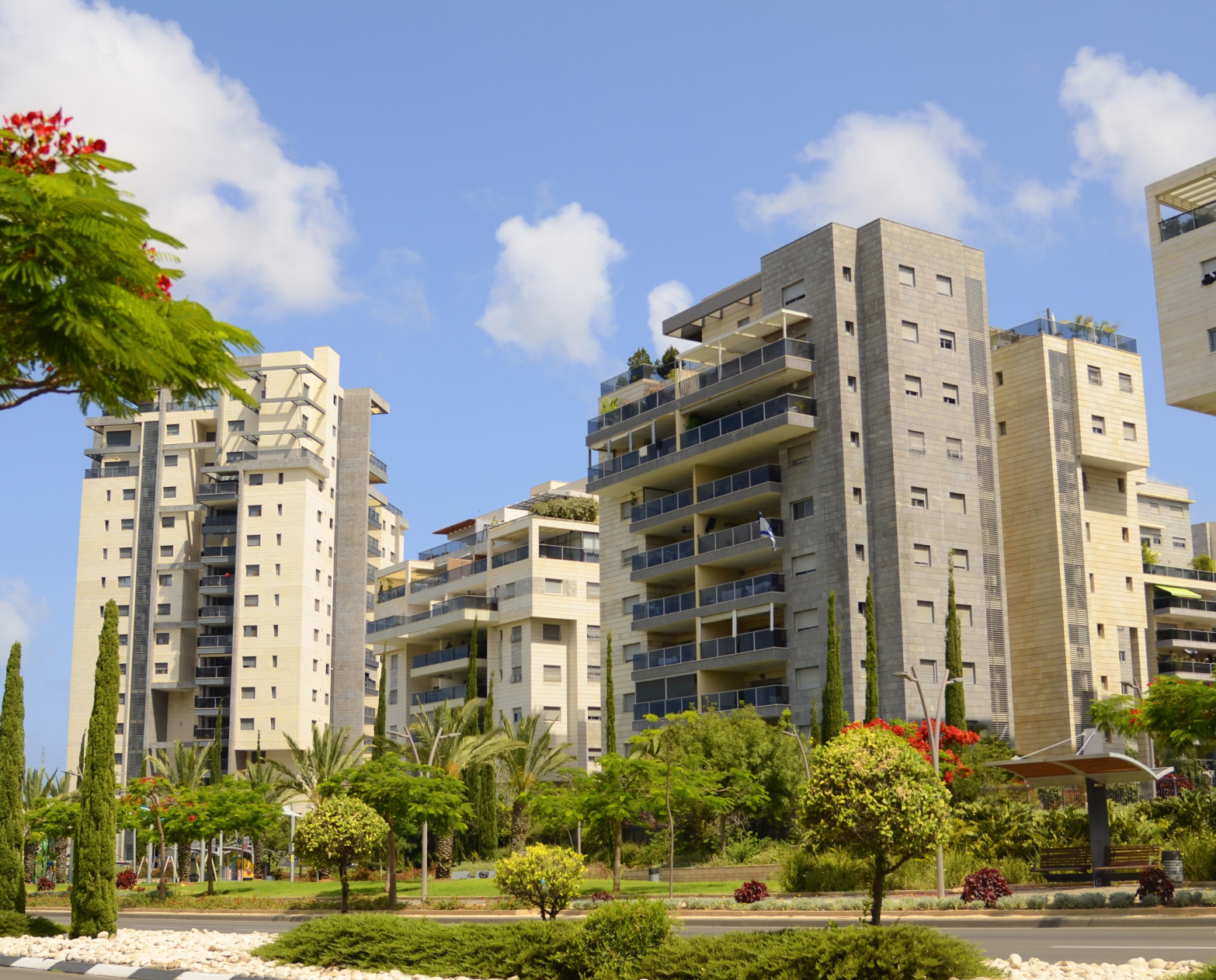 stock-photo-city-for-life-beautiful-modern-urban-area-flowering-trees-apartment-buildings-real-estate-in-2320718499 2